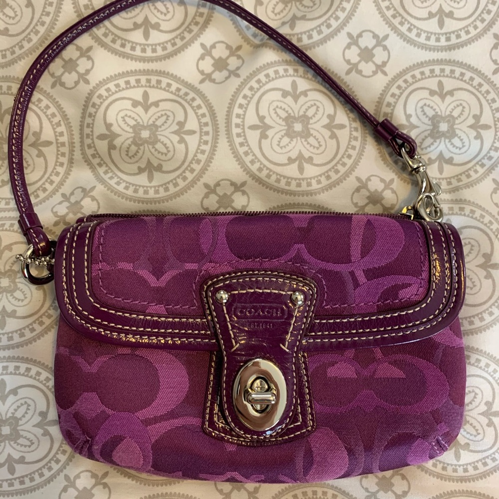 Lightly used COACH WRISTLET